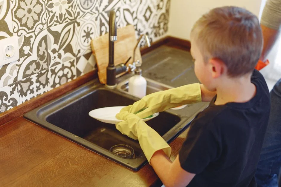 Cleaner operating a vacuum in an elegant interior, highlighting cleaning tools and methods.